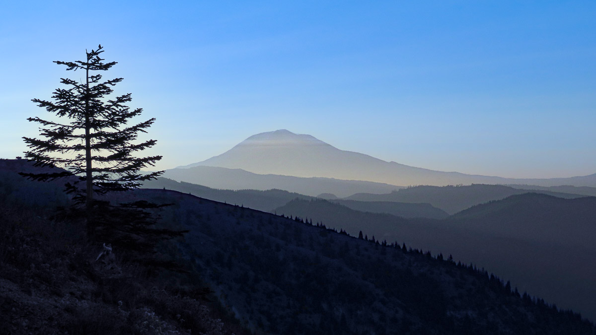 Twilight blues and layers of ridgelines leading up to Mount Adams in the Dark Divide of Washington State